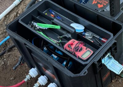 Earth-underground sprinkler control system with tools and wiring, used for automated wildfire prevention in Central Oregon, Bend area by Wildfire Watchdog.