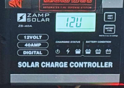 12V solar charge controller displaying 12 volts.