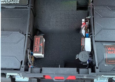 Auto fire suppression system with ESP32/ESP8266 controllers, roof, eave, and ground sprinklers installed in a black enclosure for wildfire prevention, monitored remotely via TagoIO in Bend, Oregon.