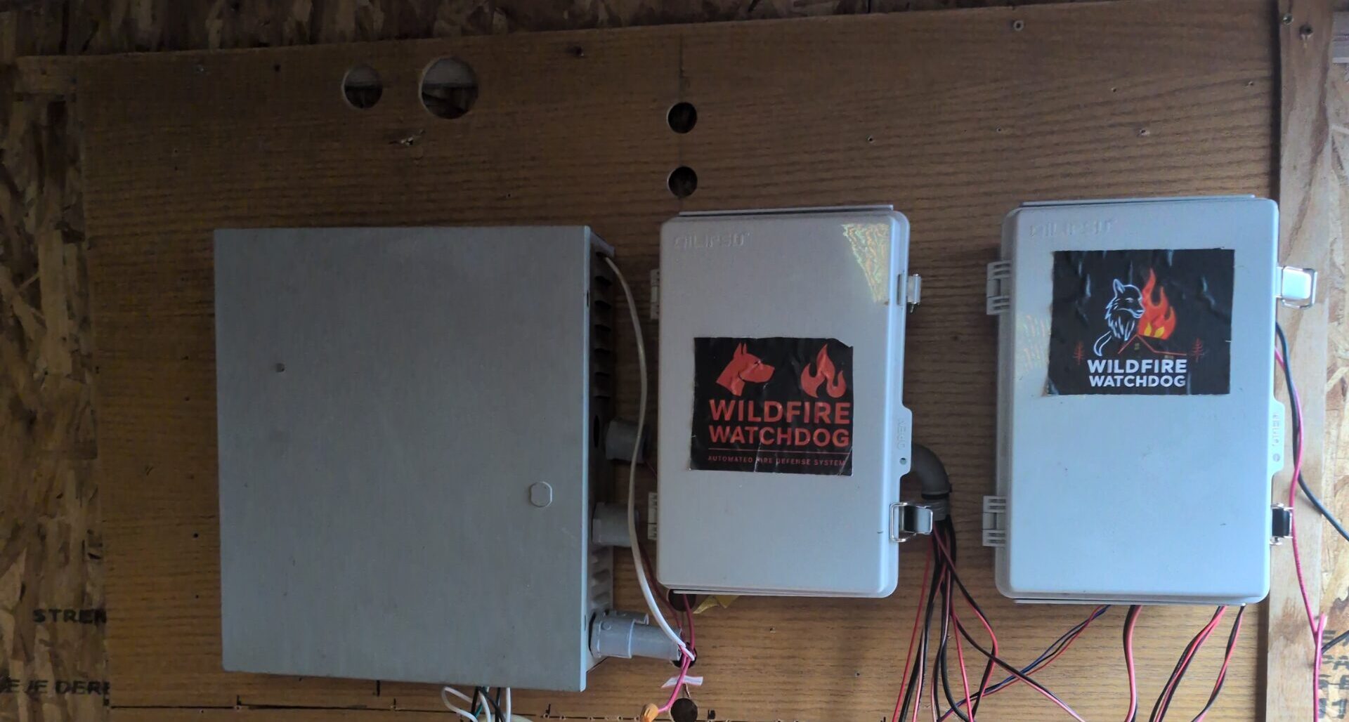 Three Wildfire Watchdog controller boxes
